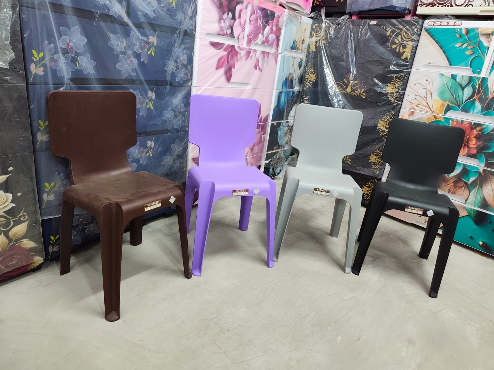 Brown, purple, grey and black chairs displayed in the showroom