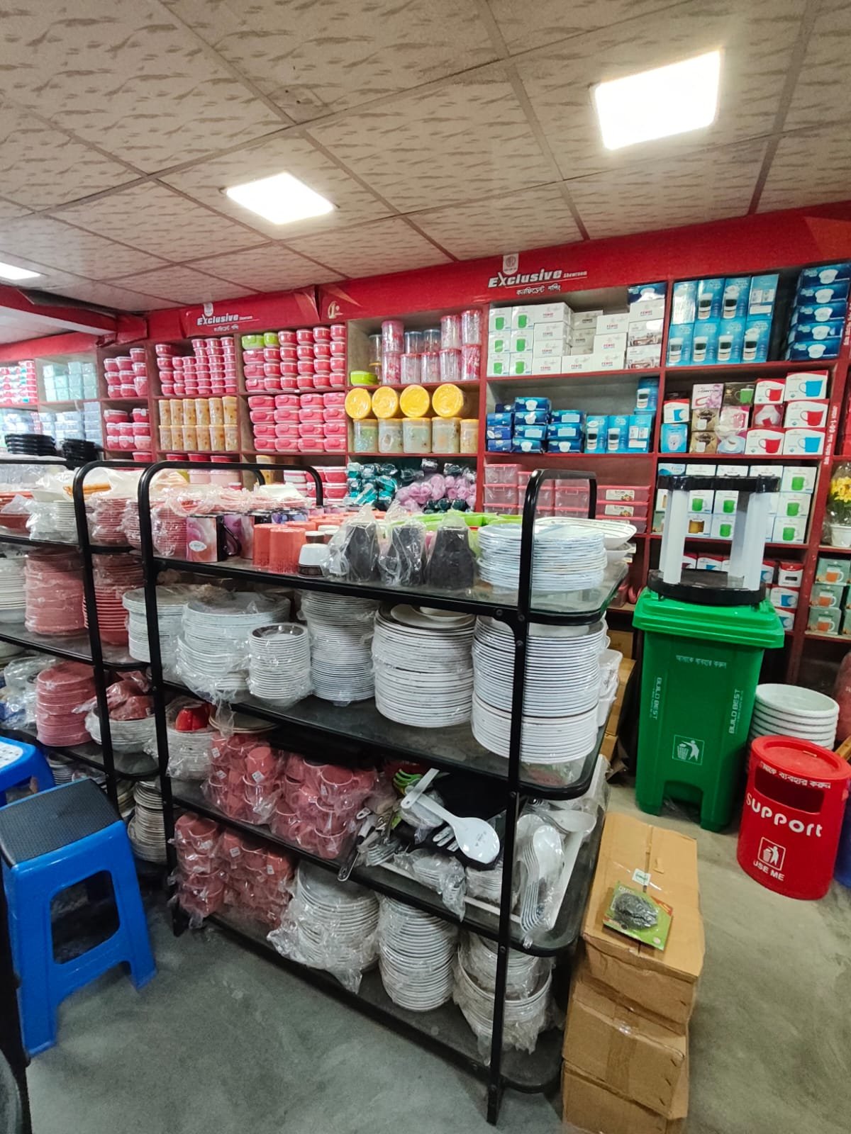 Shelves of plates, bowls and cups inside the showroom
