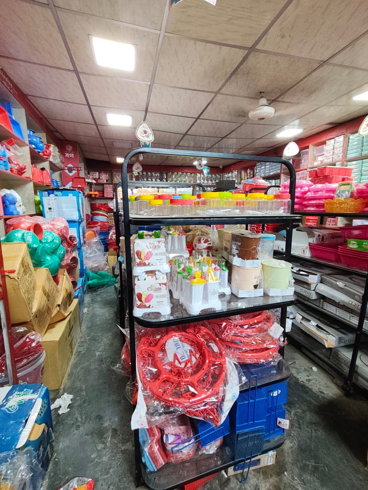An aisle of household essentials inside our showroom